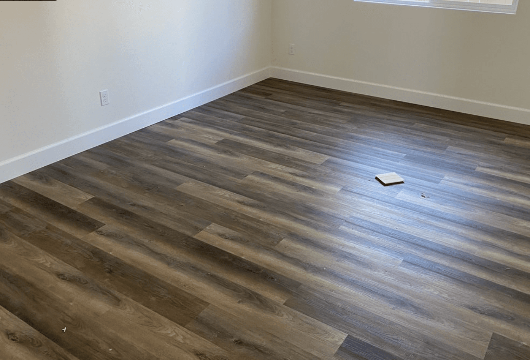 Detailed view of wood-look plank flooring installation